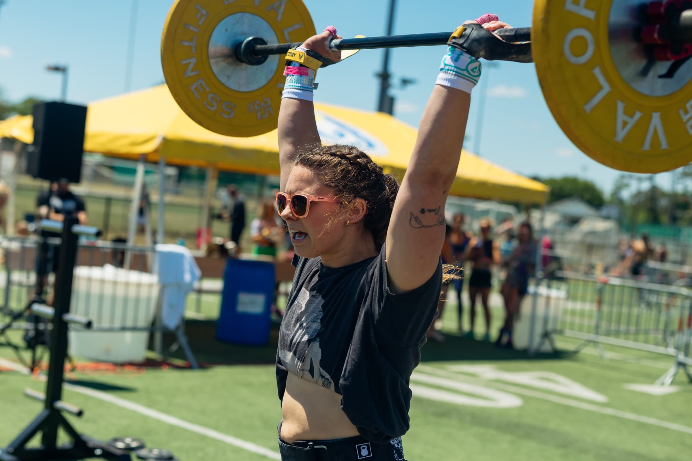 A Pack Mentality athlete finishing an overhead lift